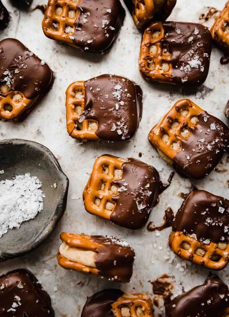 Experience the perfect blend of sweet and salty with our Peanut Butter Pretzel Bites recipe. Creamy peanut butter, mini pretzels, and luscious chocolate come together in bite-sized perfection. Ideal for snacking, gifting, or satisfying your cravings. #PeanutButterPretzelBites #SweetAndSalty #HomemadeTreats #EasyRecipe" Peanut Butter Pretzel Bites, Pretzel Desserts, Pretzel Bites Recipes, Peanut Butter Filled Pretzels, Pretzel Treats, Christmas Food Treats, Peanut Butter Snacks, Chocolate Dipped Pretzels, Peanut Butter Pretzel