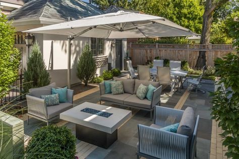 oversized shade umbrella makes the patio comfortable on sunny days -- French Provincial With A City Twist by Chicago Specialty Gardens Oversized Umbrella For Patio, French Country Patio, Roof Terrace Design, Small Patio Design, Rooftop Gardens, Patio Seating Area, Bluestone Patio, Offset Patio Umbrella, Backyard Seating