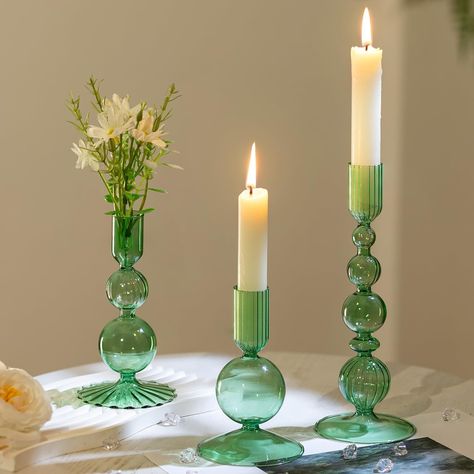 PRICES MAY VARY. Stylish Elegant Decoration: These candle holders for candlesticks feature a oblate spherical shape with elegant strips, adding a touch of delicate to any space. The multi-color allows you to blend with variety of candle colors, making them suitable for any season or decor style. Assorted Candleholder Set: This set features 3 vintage candlestick holders in varying shapes and sizes: measuring 4.72"/12 cm, 5.9"/15 cm, and 8.07"/20.5 cm in height. The candle sockets are 0.87"/2.2 cm Tall Candle Holders Decor, Green Wedding Tablescape, Candle Stick Holders Decor, Green Wedding Centerpieces, Glass Taper Candle Holders, Candle Colors, Decor For Table, Table Centerpiece Wedding, Modern Table Decor