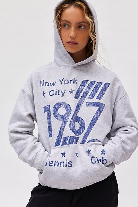 Staple hoodie sweatshirt in a slouchy, pullover style. Features a crew neckline, hood and drop shoulder balloon sleeves topped with 1967 Tennis Club graphics across the front for a sporty vibe. Only at Urban Outfitters. Features 1967 Tennis Club graphic hoodie sweatshirt Slouchy hoodie sweatshirt Crew neckline with hood and balloon sleeves 1967 Tennis Club graphics across the front Front kanga pocket Oversized fit Tunic length Easy pull-over style UO exclusive Content + Care 50% Cotton, 50% polyester Machine wash Imported Size + Fit Model in Grey is 5’9" and wearing size S/M Measurements taken from size S/M Chest: 48" Length: 27.5" | 1967 Tennis Club Graphic Hoodie Sweatshirt in Grey, Women's at Urban Outfitters Vintage Sports Sweatshirt, F1 Sweatshirt, Urban Outfitters Hoodie, Trendy Crewneck Sweatshirt, Trendy Crewneck, Vintage Graphic Tees, Women's Graphic Tees, School Sweatshirts, Crewneck Sweatshirt Women