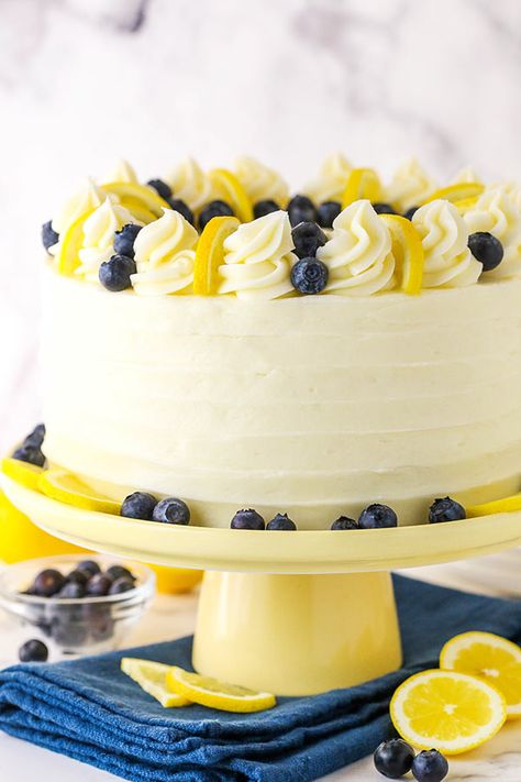 This Lemon Blueberry Layer Cake is bursting with fresh blueberries and lemon flavor. Topped with cream cheese frosting, this cake is perfect for Summer! #lemoncake #blueberrycake #summerdessert Lemon Blueberry Layer Cake, Blueberry Layer Cake, Lemon Birthday Cakes, Blueberry Lemon Cake Recipe, Lemon Blueberry Cake, Broma Bakery, Lemon Poppyseed Cake, Blueberry Cake Recipes, Gourmet Cakes