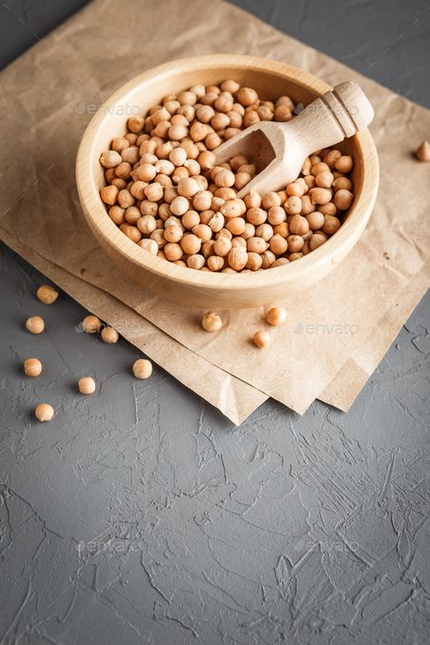 Chickpeas in a wooden bowl on gray background by Irrin. Wooden bowl with dry raw organic chickpeas on gray concrete background #Sponsored #gray, #background, #Irrin, #Chickpeas Concrete Background, Gray Concrete, Wooden Bowl, Wooden Bowls, Chickpeas, Gray Background, Wedding Photos, Nutrition, Bowl