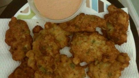 Conch Fritters Recipe - "This is a traditional Bahamian recipe that is made with conch, this wonderful shellfish that is delicious but so hard to find out from the Bahamas. These fritters are great as an appetizer, finger food or as a very tasty hors d'oeuvre to accompany your favorite tropical drink!"   Allrecipes.com Nutrition Facts:  Per Serving: 220 calories; 13.6 g fat; 14.8 g carbs; 9.6 g protein; 44 mg cholesterol; 209 mg sodium. Conch Fritters Recipe, Conch Recipes, Conch Salad, Bahamian Food, Conch Fritters, Fritters Recipe, Haitian Food Recipes, Fritter Recipes, Island Food