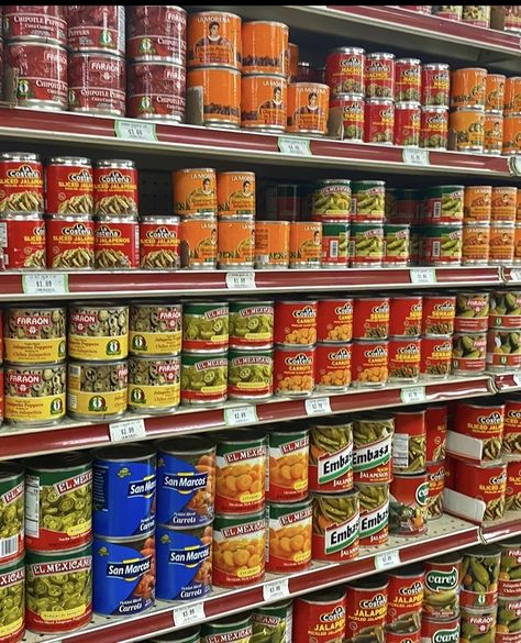 Red orange blue green canned food on Mexican grocery store aisle Mexican Household Aesthetic, Growing Up Mexican Aesthetic, Mexican Childhood Aesthetic, 90s Mexican Aesthetic, Mexican Nostalgia, Mexican Childhood, Chicano Aesthetic, Flea Market Aesthetic, Mexican Store