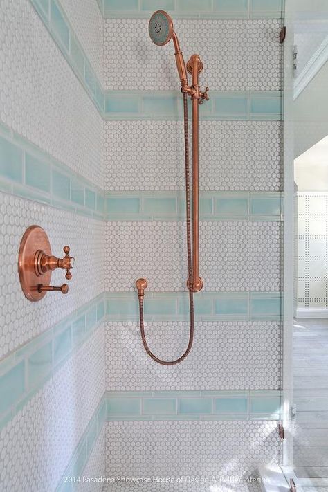 Blue and white kid's walk-in shower features an eye-catching copper shower kit mounted to white hex wall tiles accented with stripes of blue subway tiles. Bathroom Facelift, Blue Shower Tile, Copper Shower Head, Tile Shower Niche, Clean Shower, Beach House Bathroom, Shower Tiles, Transitional Bathroom, Hospital Interior Design