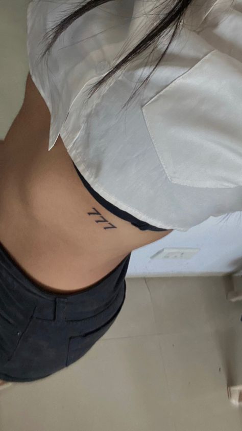 777 Rib Tattoo, 777 Chest Tattoo, Tailbone Tattoo, 777 Tattoos, 777 Tattoo Ideas, Number Angel, 777 Tattoo, Stomach Tattoos Women, Rib Tattoos For Women