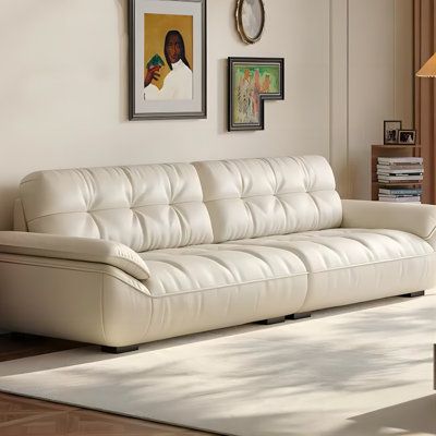 Elevate your living space with our modern cream sofa, a statement piece that exudes elegance and sophistication. Crafted with meticulous attention to detail, this sofa is designed to provide a cozy and warm ambiance, making it the perfect centerpiece for any home. The premium top-grain leather on the contact surfaces offers a tactile experience that is both delicate and clear, showcasing natural patterns that are both grand and atmospheric. The interior is filled with high-quality natural latex Cream Leather Couch Living Room Ideas, Cream Leather Couch Living Room, Cream Leather Couch, Leather Couch Living Room Ideas, Beige Leather Sofa, Cream Leather Sofa, Leather Couches Living Room, Cream Sofa, Natural Patterns