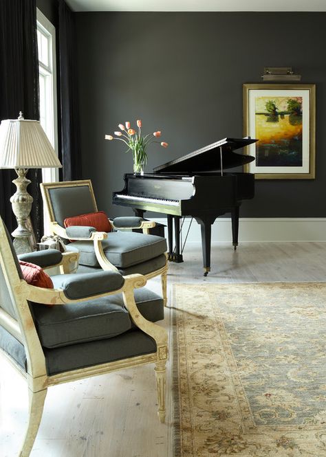 Living Room by J. Hirsch Interior Design, LLC | piano in living room | dark gray walls with light floor | traditional home decor December Pics, Grand Piano Room, Piano Room Decor, Piano Living Rooms, Montana Winter, Whitefish Montana, Dark Grey Walls, Winter City, Piano Room