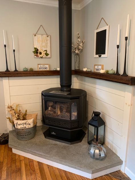 Corner Wood Stove Decor, Hearth Around Wood Stove, Fireplace Stove Wood Burning, Hearth Ideas Wood Stove, Wood Stove Basement Ideas, Decor Around Pellet Stove, Behind Pellet Stove Ideas, Harth Ideas Pellet Stove, Corner Woodstove Mantel Decorating Ideas