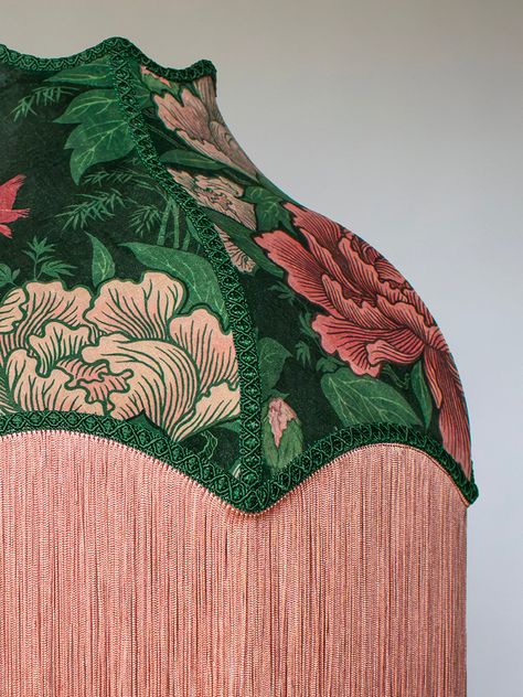 A handmade velvet lampshade in blush pink, soft rose and green, finished with ornate braiding and fringe. Bring your room into bloom with a print designed to delight – Bloomin’ Marvellous! Inspired by one of our favourite London spaces, the beautiful St James’s Park, our Bloomin’ Marvellous print features expansive blooms of trailing peonies. Set against the bucolic backdrop of the park’s Dutch Cottage, they are joined by the resident royal pelicans to create a whimsical wonderland that’s big on Lampshades Bedroom, Velvet Chandelier, Festival Activations, Funky Objects, Dutch Cottage, Lampshades Ideas, Fringe Lampshade, Velvet Lampshade, Vintage Lampshades