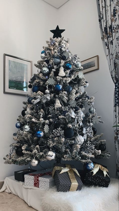 Flocked Christmas Trees Decorated Blue And Silver, Black Blue Christmas Tree, Black And Navy Christmas Tree, Blue Black Silver Christmas Decorations, Black White Blue Christmas Decor, White Silver Blue Christmas Tree, Black White Blue Christmas Tree, Silver White Blue Christmas Tree, Navy Blue Ornaments Christmas Tree