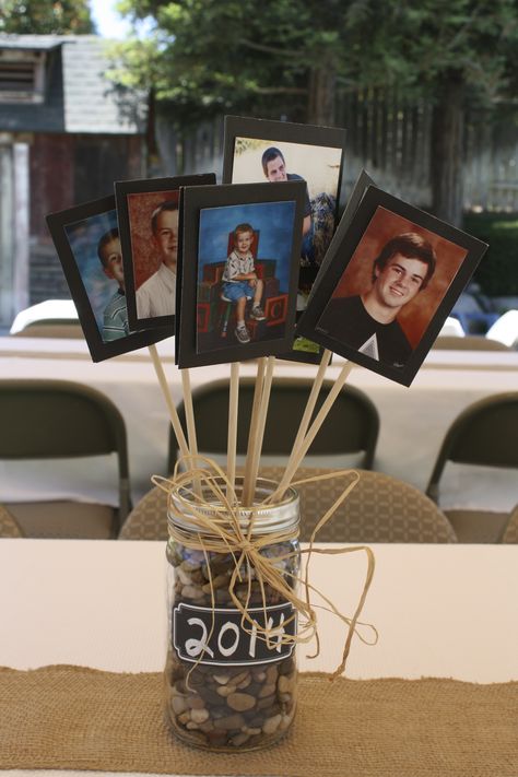 Centerpiece for tables at a graduation party.  Good for guys…no flowers.  Each picture is a school picture showcasing the grad in different grades. Boys Graduation Party, Graduation Table Centerpieces, Graduation Centerpieces, Graduation Table, Graduation Party Table, Senior Graduation Party, Boy Graduation, Graduation Party High, Graduation Open Houses