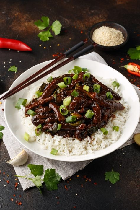 This list of Mongolian foods is full of rich stews, hearty dumplings, and slow-cooked meats. Get an authentic taste of Mongolia with these easy recipes. Mongolian Barbecue, Meat Dumplings, Beef Rice, Slow Cooked Meat, Mongolian Beef, Traditional Recipes, Ground Lamb, Fried Dough, Beef And Noodles