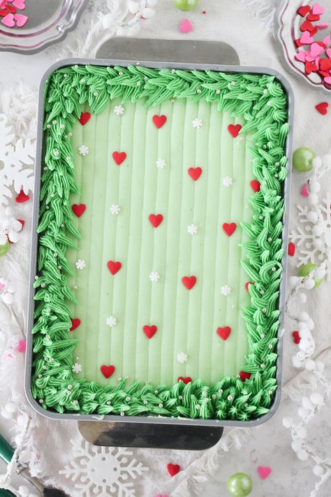 Christmas Grinch Pistachio Sheet Cake - Baking with Blondie Holiday Cakes Winter, December Potluck Ideas, Christmas Cake Rectangle, Holiday Sheet Cakes, Winter Cake Decorating Ideas, Christmas Buttercream Board, Christmas Funfetti Cake, Grinch Cake Ideas, Grinch Christmas Cake