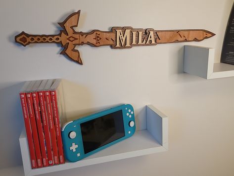 Zelda Master sword personalized available now https://etsy.me/3M2wpTr #nintendo #nintendolife #zelda #legendofzelda #breathofthewild #botw #gaming #gameroom #gamer #games #game #thelegendofzelda #videogames #kidsroom #kidsroomart #fantasy #rpg Zelda Boys Bedroom, Legend Of Zelda Room Ideas, Zelda Room Decor Diy, Legend Of Zelda Decorations, Diy Zelda Gifts, Legend Of Zelda Bedroom Ideas, Legend Of Zelda Nursery, Zelda Inspired Room, Legend Of Zelda Room Decor