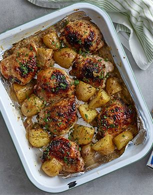 STICKY HONEY AND LEMON CHICKEN TRAYBAKE | StyleNest Chicken Thigh Traybake, Lemon Chicken Tray Bake, Chicken Traybake Recipes, Traybake Chicken, Roasting Recipes, Chicken Tray Bake Recipes, Sticky Lemon Chicken, Sticky Chicken Thighs, Chicken Thighs And Potatoes