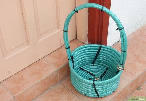 3 Ways to Make a Basket from a Garden Hose - wikiHow Diy House Warming Gift Ideas, Diy House Warming Gift, House Warming Gift Ideas, Auction Gift Basket Ideas, Fundraiser Baskets, Old Garden Tools, Make A Basket, Silent Auction Baskets, Auction Basket