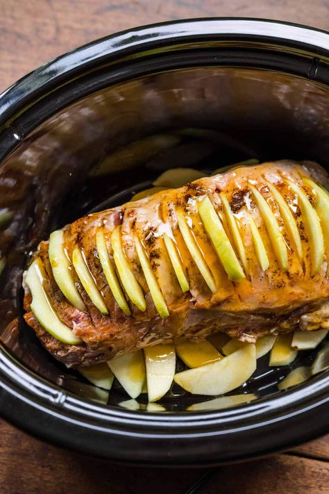 Apple Cinnamon Pork Loin is a savory, sweet, and tender roast made in a slow cooker with apples, pork loin, honey, and cinnamon. Pork Sirloin Roast With Apples, Pork Loin Recipes Crockpot Apple, Apple Cinnamon Pork Loin Crock Pot, Pork Tenderloin Apples Crock Pot Recipes, Apple Pork Roast Crock Pot, Apple Pork Loin Crock Pot, Slow Cooker Apple Pork Tenderloin, Pork Tenderloin Recipes In Crockpot Apples, Pork Loin Breakfast Recipes