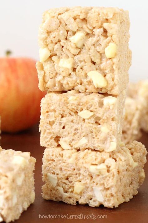 Apple Cinnamon Rice Krispie Treats stacked up in front of an apple. Christmas Rice Krispies, Fall Rolls, Cinnamon Rice, Rice Crispy Bars, Christmas Rice, Rice Krispies Recipe, Spiced Rice, Krispie Treats Recipe, Cereal Treats