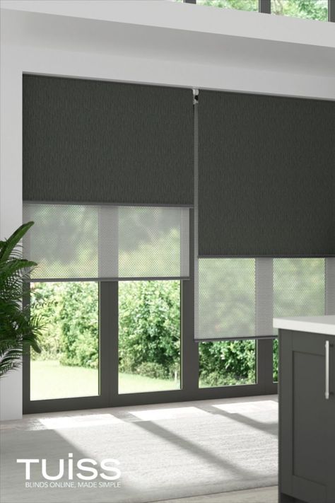 Image shows large windows covered with double roller blinds. The double roller blinds feature two fabric layers. One is a blockout for complete light control and privacy, ideal for nighttime - this shows the blockout roller in a charcoal. The second layer is a sunscreen fabric which is sheer, to cut the glare of the sun during the day and provide daytime privacy, without losing daylight or a view to the outdoors. Modern Blinds Living Rooms, Modern Window Blind, Large Windows Living Room, Window Blinds Bedroom, Blinds And Curtains Living Room, Roller Blinds Living Room, Blinds For Large Windows, Roller Blinds Bedroom, Modern Roller Blinds