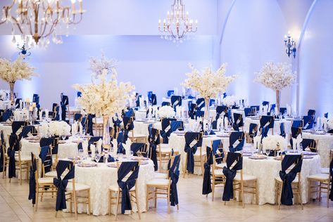 Navy blue, ivory with gold accents for a wedding reception at Villa Tuscana Reception Hall. Www.villatuscanaevents.com Ivory Gold Wedding Decor, Navy Blue Gold And Silver Wedding, Navy Blue Champagne Wedding Receptions, Navy Blue And Ivory Wedding Decorations, Champagne Gold And Navy Blue Wedding, Navy Blue And Gold Wedding Reception, Navy Blue Gold White Wedding, Champagne Gold And Blue Wedding, Ivory And Navy Blue Wedding