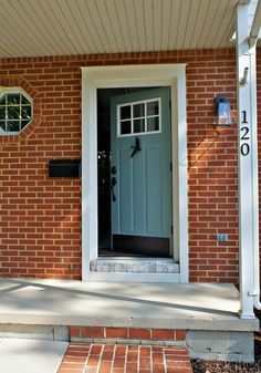 Adding trim around your door is a front door idea that gives your entryway true curb appeal, making it stand out more from the rest of the house. Brick House Front Door Colors, Brick House Exterior, Orange Front Doors, White Front Door, Front Door Ideas, Black Front Door, Front Door Trim, Brick Houses, Best Front Doors