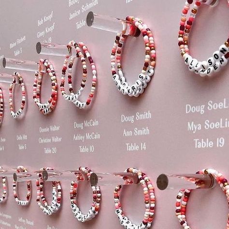 Lovely Bride ™ on Instagram: "#TheLovelyList // BFF bracelets make for the sweetest seating chart. 💕 This couple love making bracelets with their nieces and nephews, and wanted their guests to leave with the same family feeling. 🥹 ____ @bashplease @pitbullsposies @ambermoondesign" Wedding Bracelet For Guests, Bracelets Wedding, Making Friendship Bracelets, Inside Joke, Wedding Wall, Card Display, Future Wedding Plans, Wedding Name, Seating Chart Wedding