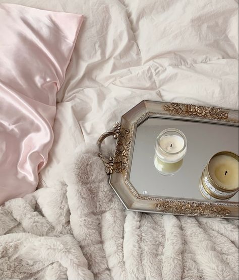 Pink satin pillow covers with a white duvet, plush off white blanket, and ornate gold mirrored tray with candles. Satin Pillows Aesthetic, Silk Bedding Set Aesthetic, Satin Bedding Aesthetic, Silk Sheets Aesthetic, Silk Bed Sheets Aesthetic, Silk Bedroom, Scented Candles Aesthetic, Breakfast In Bed Tray, Website Moodboard