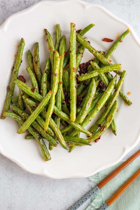 Chili crisp green beans are a flavorful side dish that lets the chili crisp shine. These spicy green beans are delicious served alongside rice and chicken, salmon, or tofu. Green Beans Air Fryer, Beans Air Fryer, Salmon Green Beans, Chilli Spice, Spicy Green Beans, Yummy Vegetable Recipes, Rice And Chicken, Chili Crisp, Green Bean Recipes