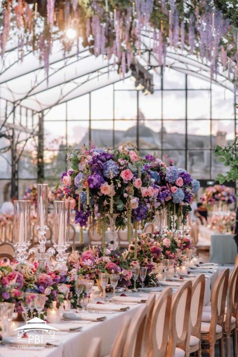 Purple Floral Centerpieces, Event Architecture, Greenhouse Venue, Event Venue Design, Event Space Design, Floral Wedding Reception, Wedding Tent Decorations, Glass House Wedding, Cascading Flowers