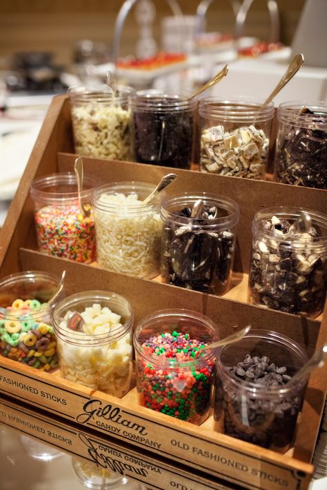 Ice Cream Sundae Bar with All the Fixings Ice Cream Topping Bar Display, Ice Cream Dessert Bar Wedding, Wedding Food Ice Cream Bar, Mini Ice Cream Bar, Sunday Ice Cream Bar, Wedding Sundae Bar Ideas, Self Serve Ice Cream Bar, Ice Cream Table Ideas Sundae Bar, Ice Cream Station Ideas Sundae Bar