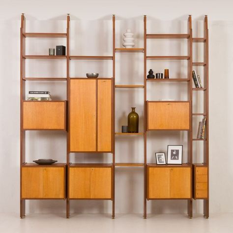 Transform your living space with this elegant Italian mid-century modern 5-bay wall unit. Featuring a sleek freestanding design, this unit offers both style and functionality, perfect for organizing books, décor, and storage items. #MidCenturyModern #ItalianDesign #VintageWallUnit #ModularShelving #ItalianFurniture #RetroDecor #TeakFurniture #VintageStorage #InteriorDesignInspo #FreeStandingUnit Tall Bar Cabinet, 1960s Chairs, Vintage Shelving, Small Chest Of Drawers, Italian Mid Century Modern, Furniture Bookshelves, Pendant Ceiling Lamp, Bookcase Shelves, Table Bar