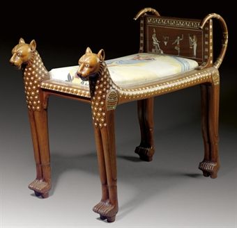 AN EGYPTIAN REVIVAL MOTHER OF PEARL-INLAID SOLID ROSEWOOD STOOL**  CIRCA 1900  Formed as two dogs flanking a slip seat and an inlaid back panel of ancient Egyptian scenes  26 in. (66 cm.) high, 15½ in. (38.5 cm.) wide, 35 in. (89 cm.) deep Ancient Egypt Furniture, Pharaonic Furniture, Ancient Egyptian Furniture, Egyptian Interior Design, Egypt Furniture, Egyptian Chair, Egyptian Interior, Ancient Furniture, Egyptian Furniture