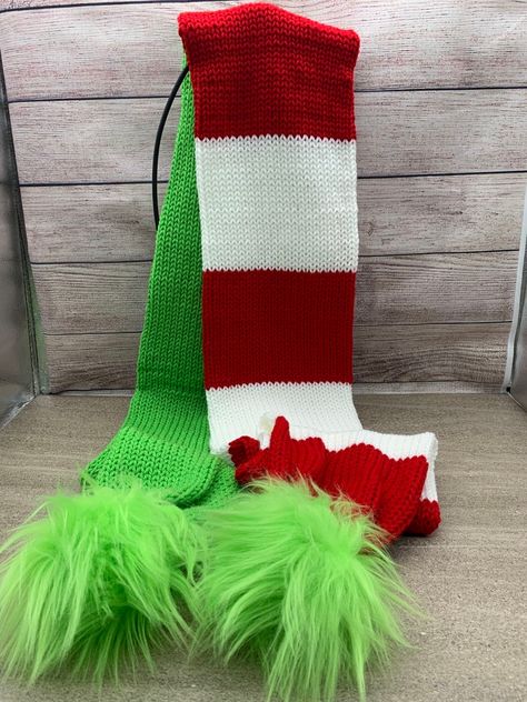 Knitted Grinch scarf. The scarf is approximately 72"long by 6.5" wide, with a removable faux fur Pom-Pom at each end Grinch Knitted Scarf, Funny Crochet Scarf Patterns, Grinch Scarf, Addi Machine, Loom Knitting For Beginners, Loom Scarf, Addi Knitting Machine, Knitting Scarves, Loom Projects