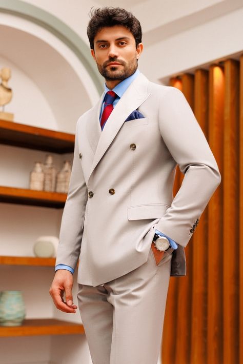 Exude confidence and sophistication with our light grey double-breasted suit 2-piece, featuring peak lapels and functioning buttoned cuffs for a touch of elegance and authority. #doublebreastedsuit #mensfashion #peaklapels #doublebreastedblazer #suitup #dapper #fashionformen Modern Suits Men, Terracotta Suit, Groom And Groomsmen Suits, Suit Groom, Dapper Suits, Suit Stores, Elegant Suit, Black Suit Men, Suit Tuxedo