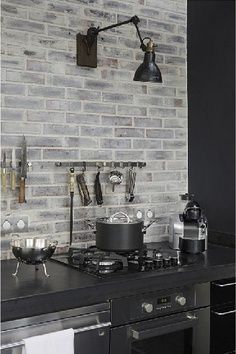 soapstone counter with painted brick backsplash Серая Кухня, White Wash Brick, Brick Kitchen, Black Countertops, Brick Backsplash, Grey Brick, Grey Kitchen, Industrial House, Trendy Kitchen