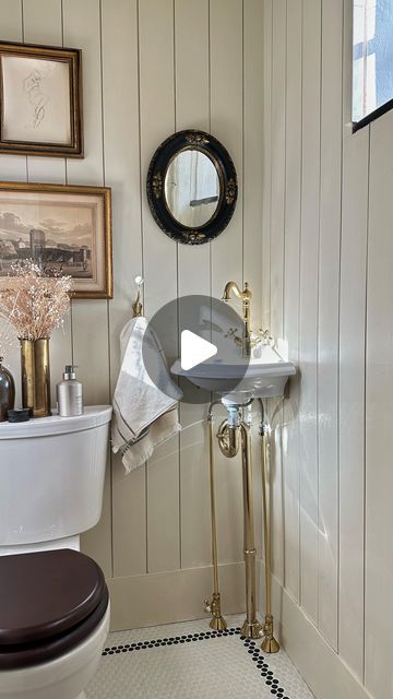 Deborah Foglia on Instagram: "A little bit of sweat and DIY brought this space from 1960’s to cutie English cottage powder room. Can you believe that we went over all the tile???? It saved us time and demo work! My fav details are the wooden toilet seat and corner sink. I’ll be linking these soon to shop on #ltkit and on the blog! #englishcottage #cottagecoreaesthetic #powderroom #bathroommameover" Powder Room Corner Sink, Cottage Powder Room, Wooden Toilet Seat, Wooden Toilet Seats, Corner Sink Bathroom, Wooden Toilet, Basement Bathroom Remodeling, Corner Sink, Hall Bathroom