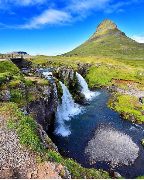 Kirkjufell Mountain and Waterfalls, Grundarfjörður, Iceland 🇮🇸 This image showcases the iconic Kirkjufell Mountain, one of Iceland's most photographed landmarks, along with the serene waterfalls that lie at its base. Located near the town of Grundarfjörður on the Snæfellsnes Peninsula, Kirkjufell's unique shape and the surrounding natural beauty make it a must-visit destination for nature lovers and photographers alike. Kirkjufell Mountain, Snaefellsnes Peninsula, Nature Lovers, Nature Lover, Iceland, Travel Destinations, Natural Beauty, Photographer, Travel