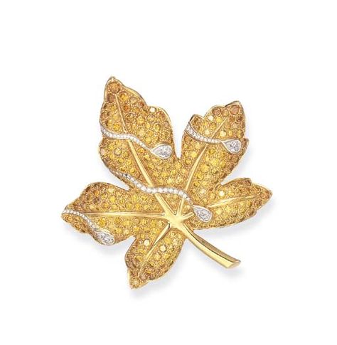 A COLORED DIAMOND BROOCH, BY VAN CLEEF & ARPELS   Designed as a pavé-set yellow diamond maple leaf, enhanced by circular and pear-shaped diamonds, accented by polished gold veining and stem, mounted in 18k gold, with French assay marks and maker's marks, in a Van Cleef & Arpels blue leather case  Signed Van Cleef & Arpels, no. N.Y. 61763 Jewelry Looks, Crochet Beads, Van Cleef And Arpels Jewelry, Inexpensive Jewelry, Van Cleef And Arpels, High Jewellery, Bling Wedding, Wedding Sash, Diamond Brooch