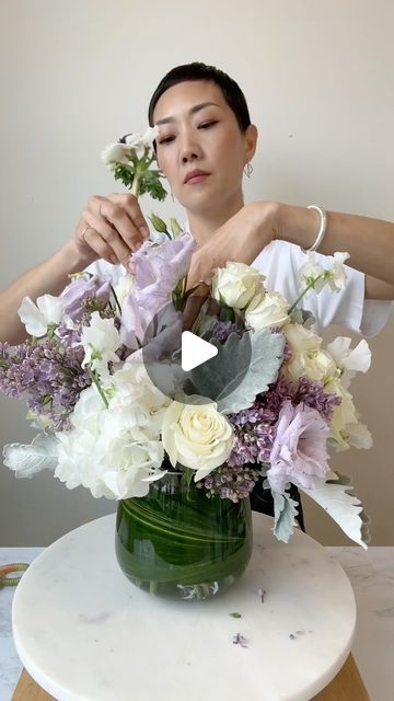 NYC Wedding and Events Florist on Instagram: "A plushier larger version of the purple arrangement featuring lilacs, sweet peas, and anemones. ✔️Save✨Like✨Share✨Follow for an even plushier purple coming soon 💜 🎥 I film in the kitchen of my flower studio, and my mom (who works here) kept interrupting to make me lunch 😊🍜 #flowerarranging #floraldesign #floristsofinstagram #nycflorist #rachelchofloral" Purple And White Flower Arrangements, Lilac Flower Arrangements, Purple Floral Arrangements, Purple Flower Arrangements, Florist Studio, Nyc Florist, Floral Arranging, Flower Studio, Sympathy Flowers