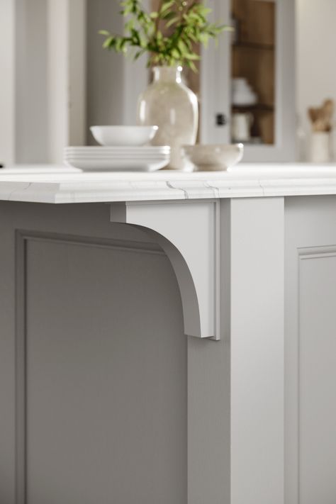 Are you in need of kitchen decor ideas? Our Howdens Wooden Corbel Shelf Bracket is perfect for your kitchen decor inspiration. These brackets help to add a luxury kitchen design that looks amazing with white marble kitchen countertops. This grey kitchen design is completed with a kitchen plant and your favourite kitchen crockery. Kitchen Island Brackets, Island With Corbels, Island Corbels, Kitchen Island Corbels, Corbels Kitchen, White Marble Kitchen Countertops, Marble Kitchen Countertops, Kitchen Crockery, Marble Kitchen Island