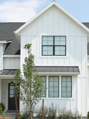 White Vertical Siding Exterior, White Vertical Siding, Stone Cottage Exterior, Barn Exterior Ideas, Vertical Siding Exterior, White Vinyl Siding, Vertical Vinyl Siding, Vinyl Siding House, Siding Repair