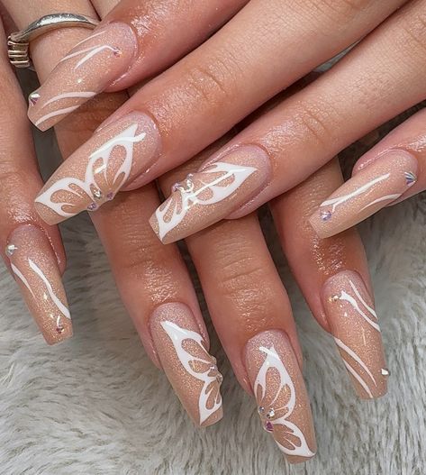 simple yet classy white butterfly nails ✨ the sparkles are so pretty 🤩 gel fill w/ hand painted nail art done on @kennedydav1s_ <3 @stellar_gel - stellar bond - hard structure gel natural - stellar white - stellar shine top @madam_glam - 35% off code - jadeaesthetic35 - holographic cat eye @dndgel - dnd 871 how do u neutral? #butterflynails #whitebutterflynails #sparklybutterflynails #sparklenails #nudesparklenails #classynails #fallnails #winternails #simplenailart #cutenailart #nail... White Buterfluffy, Buterfluffy Nails, White Butterfly Nails, Hand Painted Nail Art, Gel Natural, Madam Glam, Butterfly Nails, Painted Nail Art, Sparkle Nails