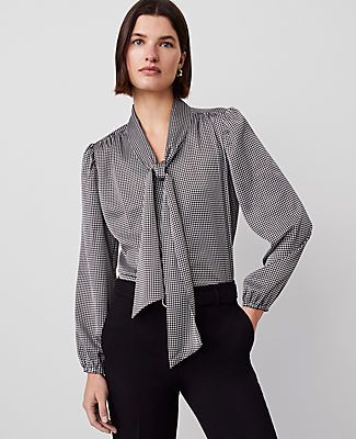 Tied at the neck for a feminine twist, this houndstooth blouse is as timeless and tailored as they come. V-neck with ties. Long sleeves with elasticized cuffs. Shirred forward shoulder seams. Shirttail hem.,Hit:26" long,Imported:Imported,Fit:Classic,Fabrication:100% Polyester,Garment Care:Machine Washable Houndstooth Tie Neck Blouse by Ann Taylor Size regular - XS Black Women's V-Neck, Long, Sleeve, Blouse, Tops, 100%, Polyester, Machine, Washable Blouses Work, Blouses For Work, Lawyer Fashion, Fitted Shirts, Tie Neck Blouse, Blouse Tops, Work Tops, Work Blouse, Tie Neck