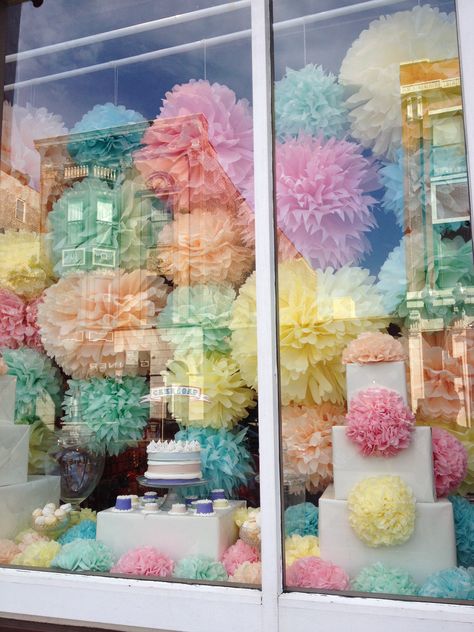 pom-pom window display // chicago Window Display Background, Art Gallery Window Display Ideas, Grand Opening Window Display, Easter Shop Window Displays, Birthday Window Display, Bakery Window Display, Easter Window Display, Boutique Window Displays, Spring Window Display