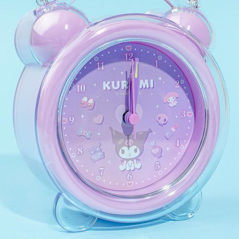 This purple alarm clock is encased in a clear frame and has a kawaii print of Kuromi and her favorite beauty products like lipstick and perfume! You can easily set up the time and the alarm by using the knobs on the back, and even switch the sound of your alarm with its multiple melody options. Place this special clock on your bedside table to add a dose of cuteness to your bedroom! Features a light switch, a bell and melody sound switch, and a snooze function Comes with 12 interchangeable melody sounds Runs on 2 AA-sized batteries (sold separately) Purple Alarm Clock, Kitty Videos, Cute Alarm Clock, Christmas Art For Kids, Hello Kitty Videos, Soft Things, Beauty Haul, Purple Bedrooms, Cute School Stationary