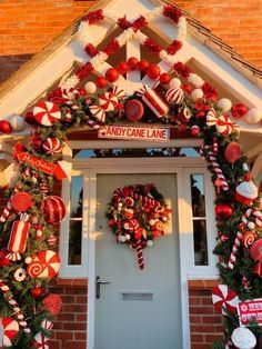 Candy Cane Theme Decorations Outdoor, Candy Cane Entryway, Candy Cane Door Garland, Outdoor Christmas Arch Ideas, Peppermint Porch Decor, Candy Cane Christmas Decorations Outdoor Front Porches, Candy Cane Christmas Outdoor Decorations, Candy Cane Lane Outdoor Decorations, Christmas Porch Archway