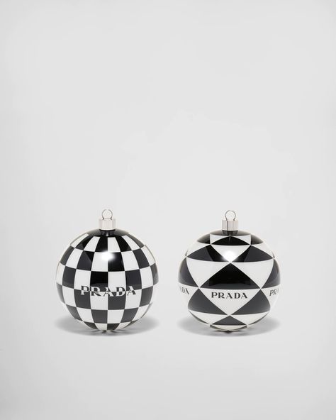 Designed as a collector's item or as a unique and timeless gift, this set of glass Christmas ornaments features geometric patterns characteristic of the brand and decorated with the Prada logo. Yellow Glitter, Mens Holiday, Prada Logo, Wreath Supplies, Christmas Flowers, Wedding Ribbon, Silver Jewels, Christmas Ornament Sets, Triangle Logo