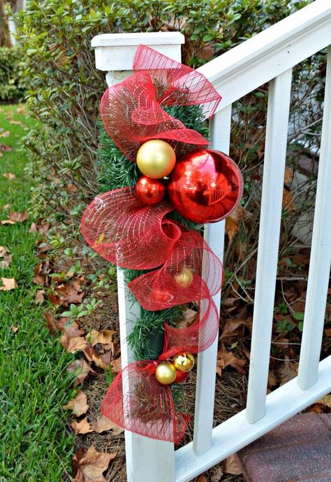 “I love this idea I'm going to Dollar Tree NOW!” said a reader when she saw this Christmas porch idea! Diy Christmas Decorations Dollar Store, Dollar Store Diy Christmas, Ideas Decoracion Navidad, Dollar Store Christmas Decorations, Dollar Store Christmas, Porch Railing, Christmas Porch Decor, Creation Deco, Christmas Swags