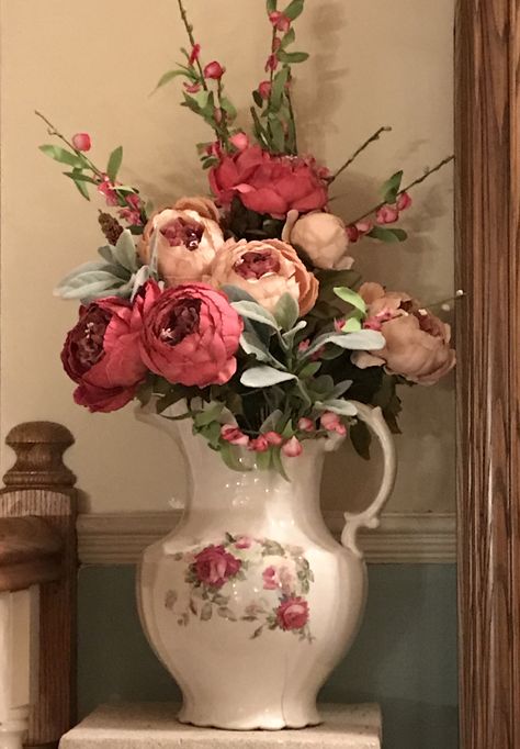 Faux Peonies and Roses in an Antique Pitcher. Antique Floral Arrangements, Decorating With Pitchers, Pitcher Arrangements, Vintage Coffee Table Decor, Pitcher Centerpiece, Centerpieces Greenery, Faux Peonies, Spring Centerpieces, Vintage Flower Arrangements